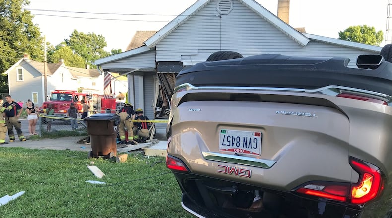 A car ended up on its top after the driver fled a traffic stop and crashed into a home at York and Kenton streets in Springfield on Thursday, June 28, 2018.