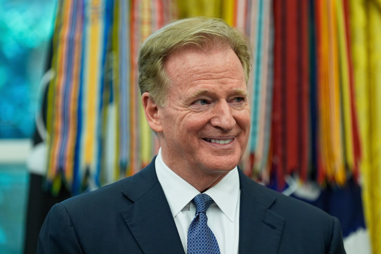 NFL Commissioner Roger Goodell listens as President Donald Trump speaks during an event to announce that the 2027 NFL Draft will be held on the National Mall, in the Oval Office of the White House, Monday, May 5, 2025, in Washington. (AP Photo/Alex Brandon)
