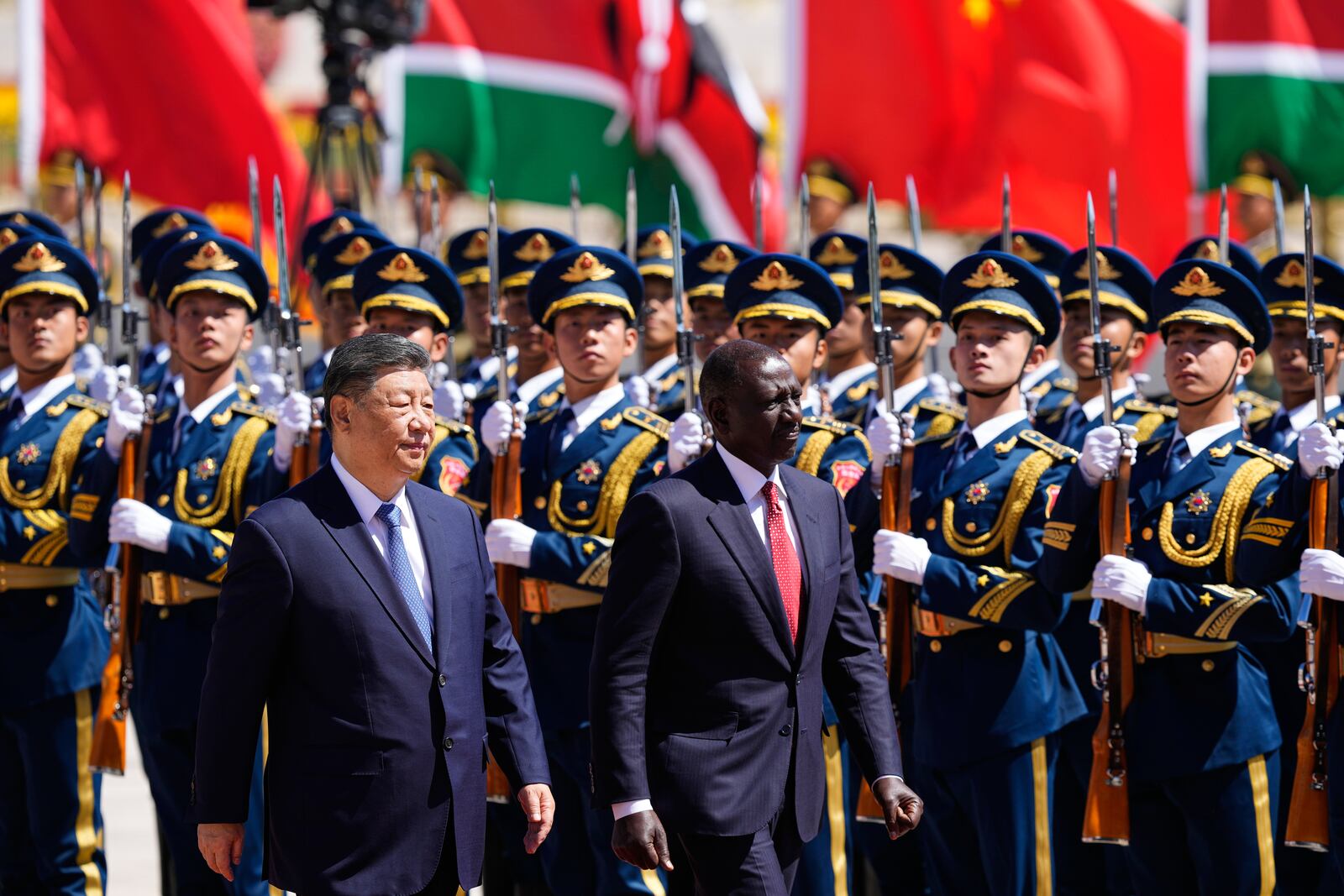 Chinese President Xi Jinping, left, and Kenyan President William Ruto attend a welcome ceremony at the Great Hall of the People Thursday, April 24, 2025 in Beijing, China. (Iori Sagisawa/Pool Photo via AP)