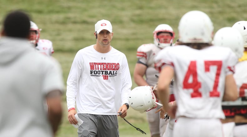 Wittenberg’s Reed Florence coaches at practice on Monday, Aug. 29, 2017, in Springfield. David Jablonski/Staff