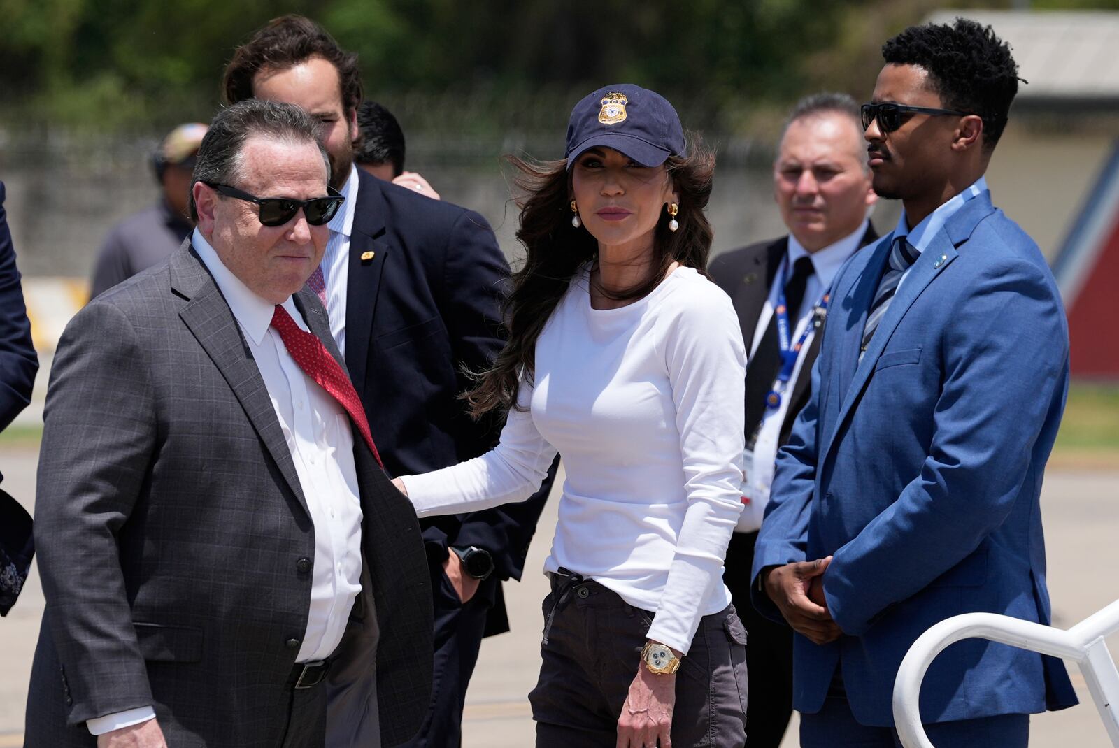 U.S Ambassador William H. Duncan, left, receives Homeland Security Secretary Kristi Noem after she arrived at the Comalapa International Airport, in San Salvador, El Salvador, Wednesday, March 26, 2025. (AP Photo/Alex Brandon)