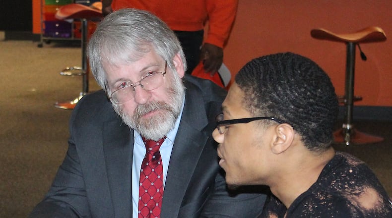 State Superintendent of Public Instruction Paolo DeMaria (left) listens to Darius Watkins discuss the impact of Career ConnectED on his education. Ohio has had only an interim state superintendent since DeMaria resigned in September 2021. JEFF GUERINI/STAFF
