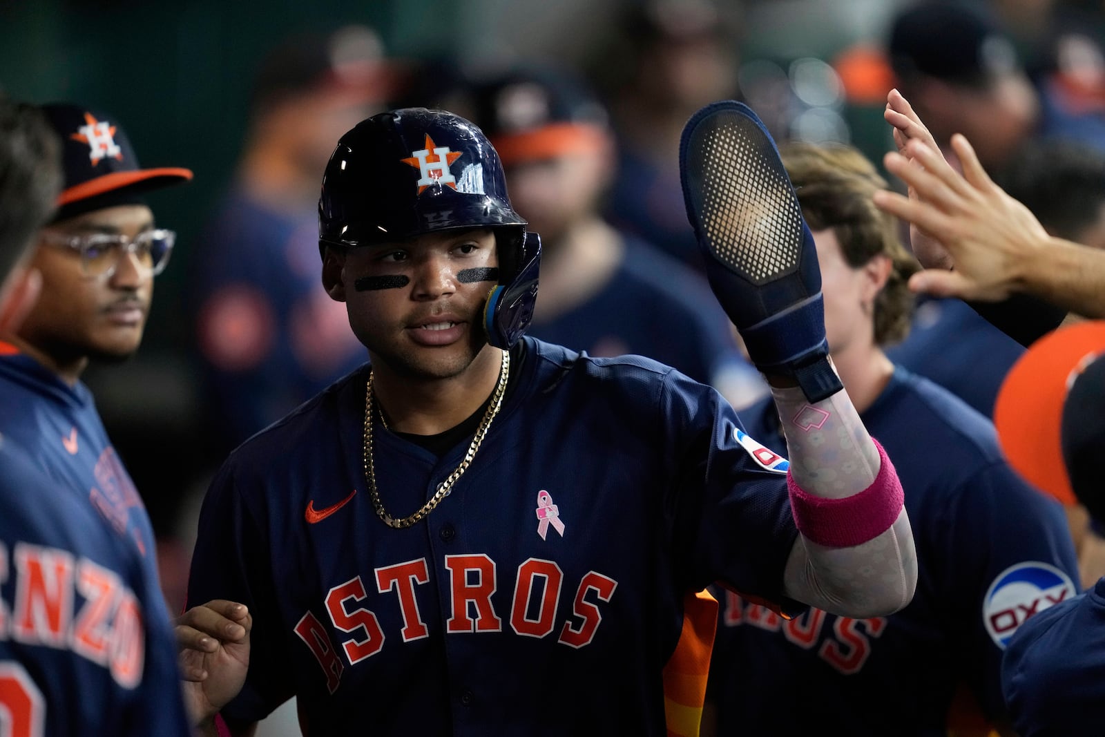Houston Astros' Cam Smith celebrates after scoring off of a sacrifice fly by Christian Walker during the fourth inning of a baseball game against the Cincinnati Reds in Houston, Sunday, May 11, 2025. (AP Photo/Ashley Landis)