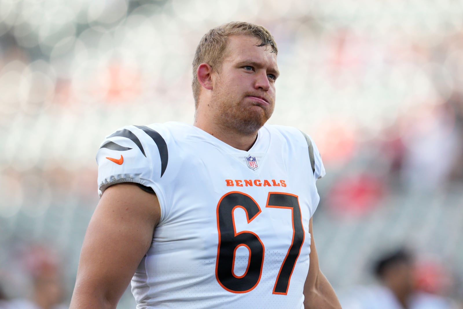 Cincinnati Bengals offensive tackle Cordell Volson exhales during warmups before an NFL football preseason game against the Arizona Cardinals in Cincinnati, Friday, Aug. 12, 2022. (AP Photo/Michael Conroy)