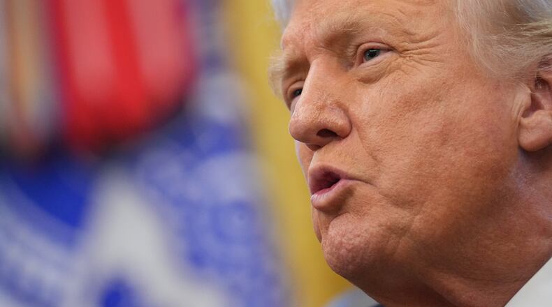 President Donald Trump speaks to reporters after Vice President JD Vance swore in U.S. Ambassador to India Sergio Gor in the Oval Office of the White House, Monday, Nov. 10, 2025, in Washington. (AP Photo/Jacquelyn Martin)