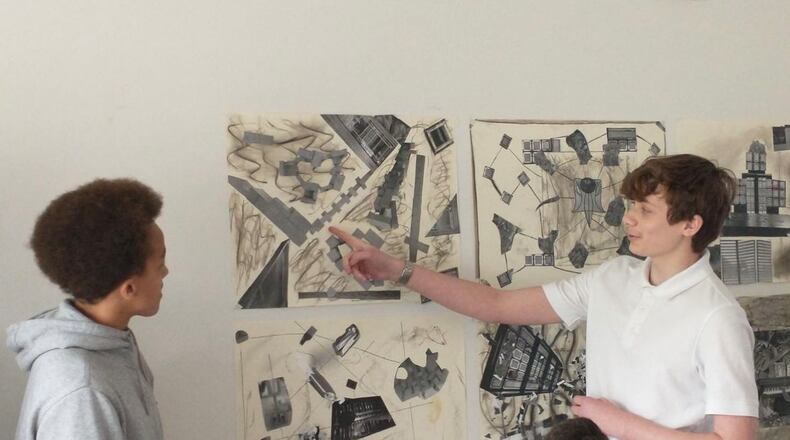 Catholic Central students Will Bias (left) and Lucas Wagner right) work in a class during the school's Enrichment Term. This is held during May each year for students to take non traditional courses, internships or study abroad to allow them to take elective courses that interest them, participate in an internship that allows them the opportunity to see if it's a field they'd like to pursue or travel abroad to learn more about the history and Irish/Catholic culture. Contributed