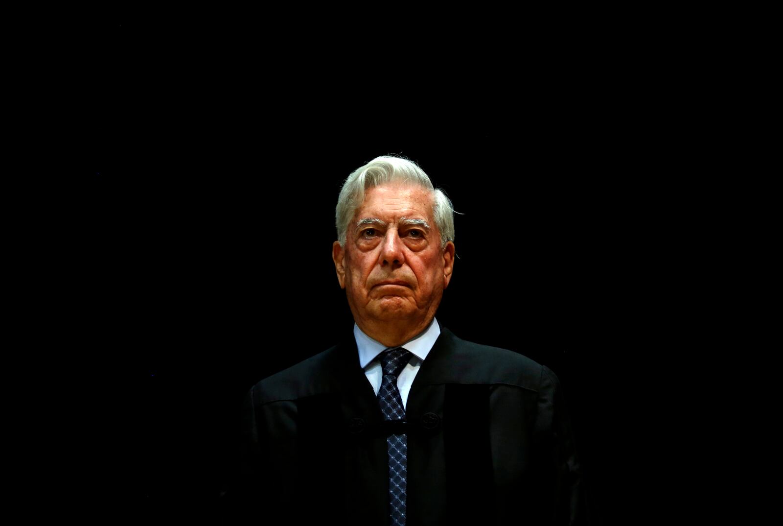 FILE - Peru's Nobel Literature Prize laureate Mario Vargas Llosa attends a ceremony where he was given an Honoris Causa degree by Lisbon Nova University, in Lisbon, Portugal, July 22, 2014. (AP Photo/Francisco Seco, File)