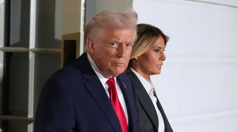 President Donald Trump and first lady Melania Trump, walk out of the White House, Tuesday, Feb. 24, 2026, to travel to the U.S. Capitol where he will deliver the State of the Union address to a joint session of Congress in the House chamber, in Washington. (AP Photo/Manuel Balce Ceneta)