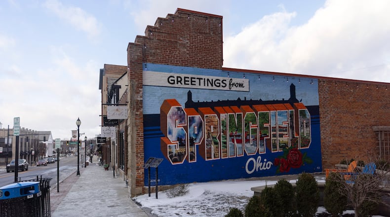 A “Greetings from Springfield Ohio” mural in Springfield, Ohio, Jan. 15, 2026. In Springfield, which was thrust into the spotlight by President Trump during the 2024 campaign, hundreds of people turned out to back Haitians living in the city. (Maddie McGarvey/The New York Times)