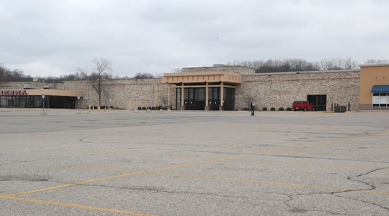 The parking lot of the Upper Valley Mall was empty Tuesday after it closed due to the stay-at-home order. BILL LACKEY/STAFF