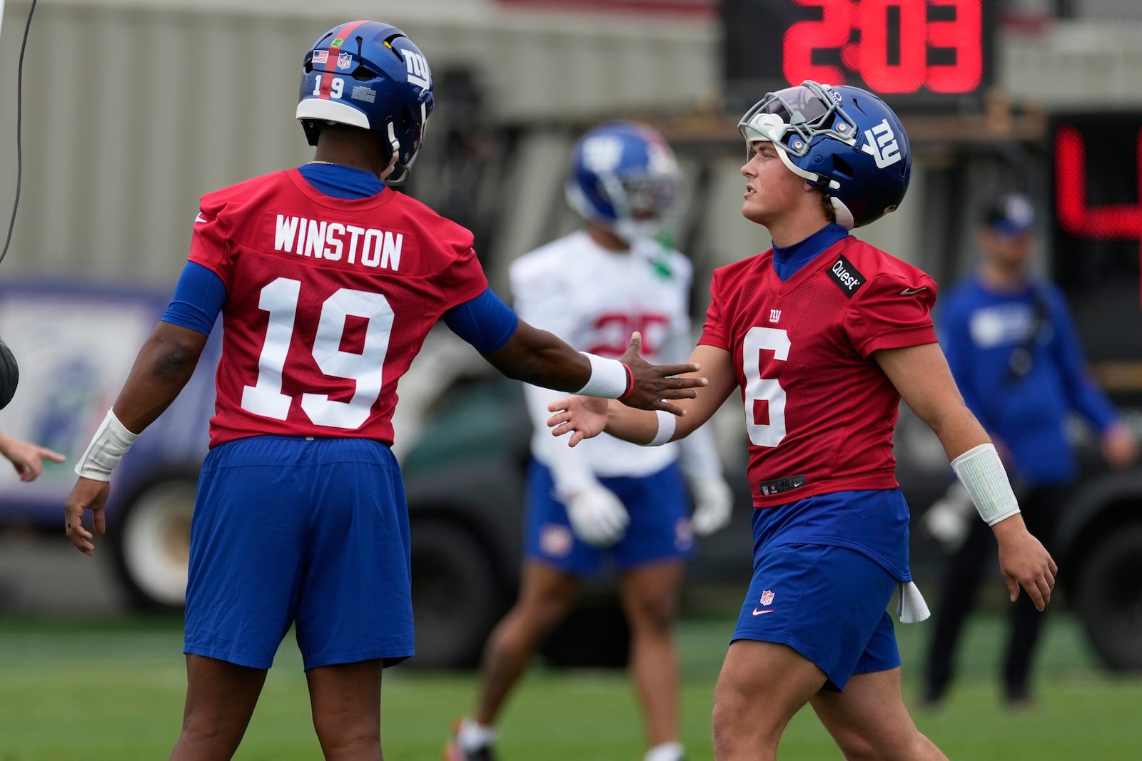 New York Giants quarterbacks Jameis Winston, left, greets Jaxson Dart during an NFL football practice in East Rutherford, N.J., Wednesday, May 28, 2025. (AP Photo/Seth Wenig)