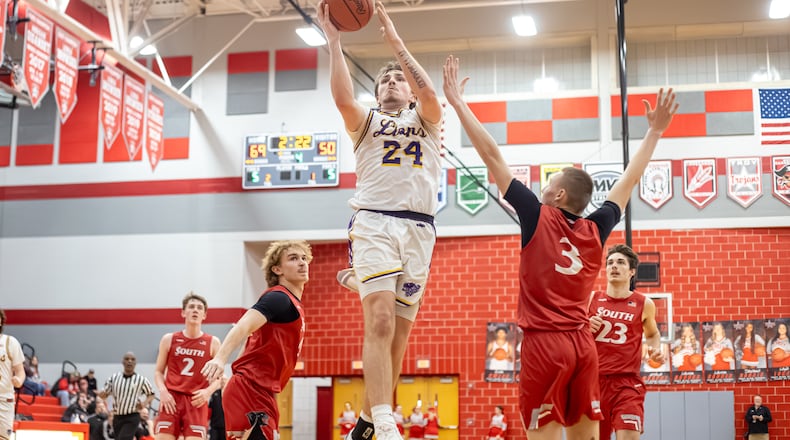 Emmanuel Christian senior Nate Hudson drives to the hoop during their 73-51 victory over Twin Valley South 73-51 in a Division VI district semifinal game on Monday, March 3, 2026 at Troy High School. MICHAEL COOPER / STAFF