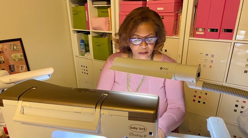 Alcelia Ford, wife of Stockbridge Mayor Anthony Ford, making a face mask.