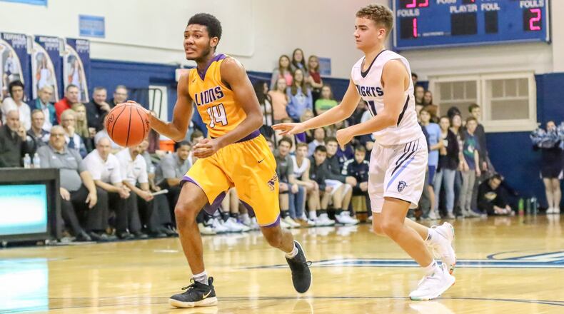 Cutline 1: Emmanuel Christian Academy’s Fred Shropshire drives past Legacy Christian’s Roman Newsome during their game on Friday night in Xenia. The Knights won 63-45. CONTRIBUTED PHOTO BY MICHAEL COOPER