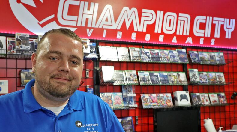 Kenneth Seelig, owner of Champion City Video Games, opened in the Park Shopping Center on Bechtle Avenue recently. BILL LACKEY/STAFF