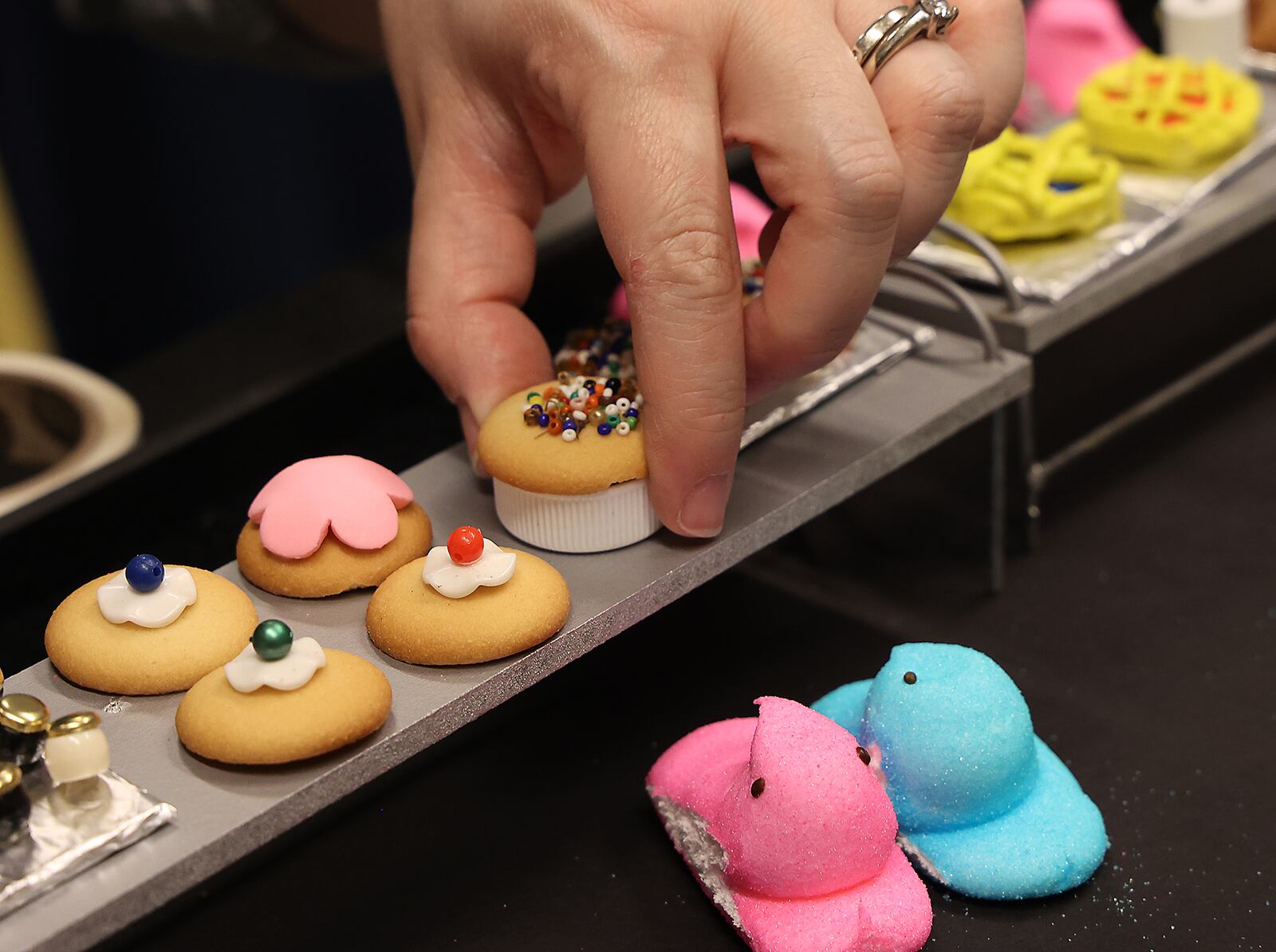 As Easter approaches, the Clark County Historical Society is recreating a historic picture of Myers Market using Peeps. The Society has been recreating scenes from Springfield's past with the sticky, marshmallow for 10 years but didn't make one last year due to COVID. When it's finished, the display can be seen in the lobby of the Clark County Heritage Center. BILL LACKEY/STAFF