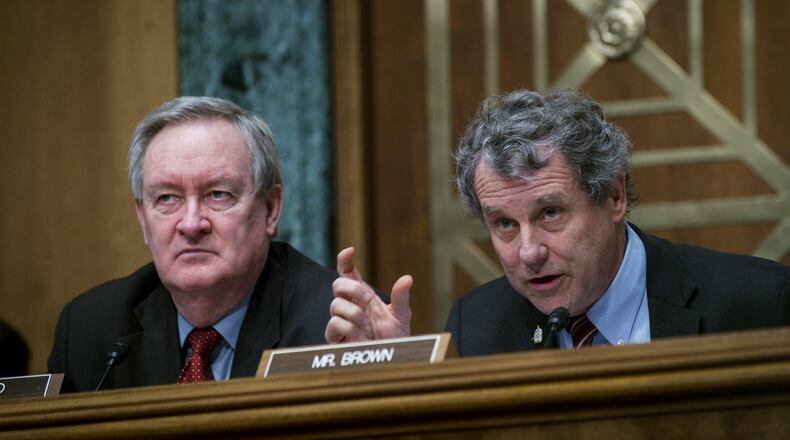 WASHINGTON, DC - JANUARY 30: Commitee Chairman Mike Crapo (R-ID) looks on as Ranking Member Sherrod Brown (D-OH) questions Treasury Secretary Steven Mnuchin as he delivers the annual financial stability report to the Senate Banking, Housing and Urban Affairs Committee on January 30, 2018 in Washington, DC. Mnuchin said the Treasury can extend the government’s debt limit suspension period into February before it exhausts its borrowing ability. (Photo by Pete Marovich/Getty Images)