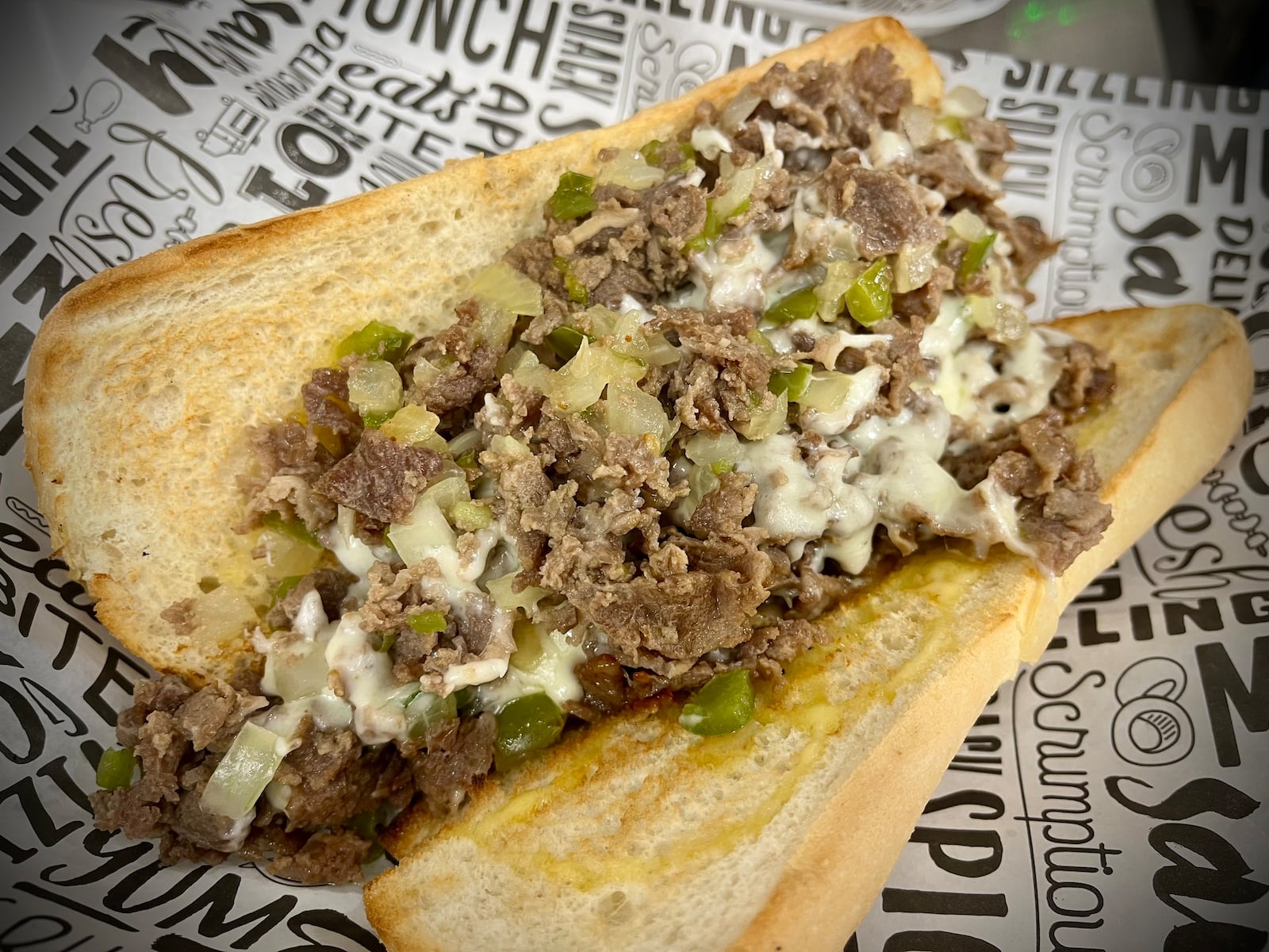 The owners of The Top Hat Sports Grill in St. Paris have opened a second location inside The Social at Piqua Center. NATALIE JONES/STAFF