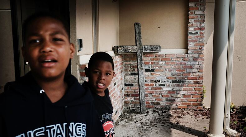 Children play at a flooded church that is now a relief center in Orange, Texas, as people in the state slowly move toward recovery from the devastation of Hurricane Harvey on Wednesday. The hurricane left many without electricity. People need to know the dangers of carbon monoxide as they turn to alternate methods for heat. GETTY IMAGES/SPENCER PLATT