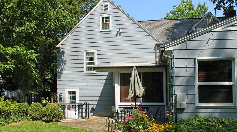 2 paver patios overlook the private backyard.
