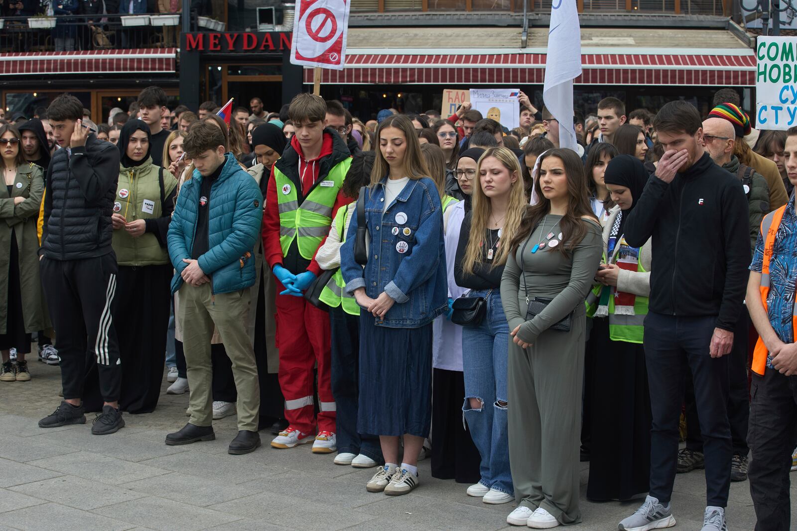 People observe seventeen minutes of silence during an anti-corruption protest in the southwestern town of Novi Pazar, Serbia, Saturday, April 12, 2025. (AP Photo/Marko Drobnjakovic)