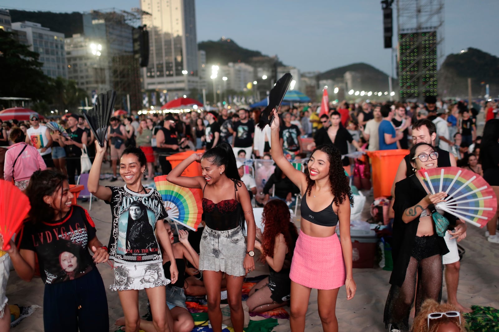 Fans cheer as they wait for the start of Lady Gaga's free concert on Copacabana beach in Rio de Janeiro, Saturday, May 3, 2025. (AP Photo/Bruna Prado)