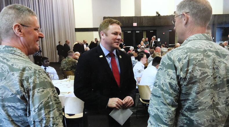 U.S. Rep. Warren Davidson’s talks to National Guard officials before the annual Military Appreciation Luncheon on Monday. Bill Lackey/Staff