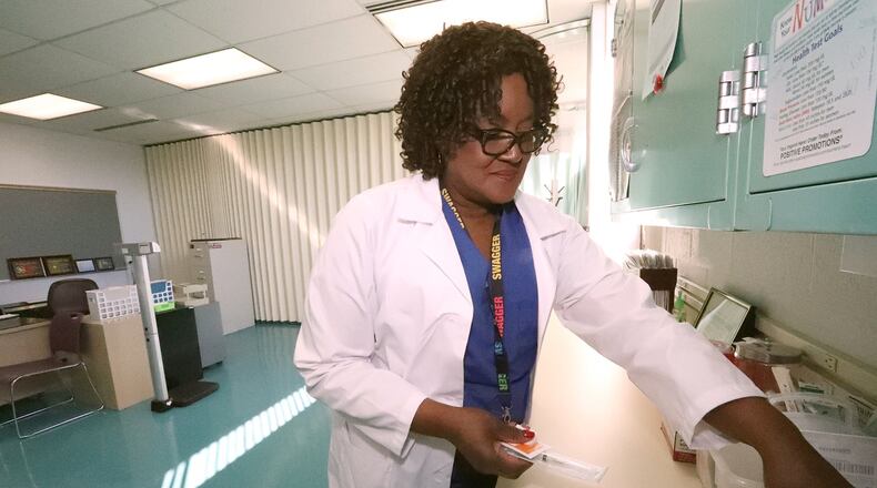 Clark State College will hold virtual information sessions this week for students interested in healthcare. Here, Vera Ruffin, RN, worked in the Clark State College’s Health Clinic in the Applied Science Center on their Leffel Lane campus a few years ago. Bill Lackey/Staff