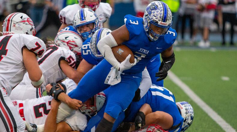 Xenia running back Trei'Shaun Sanders powers for yardage in Friday night's 27-22 victory over Tippecanoe. CONTRIBUTED/Jeff Gilbert