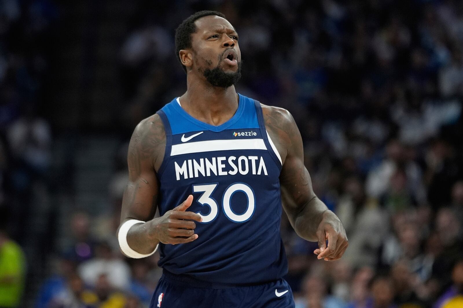 Minnesota Timberwolves forward Julius Randle (30) reacts after missing a shot during the first half of Game 4 of an NBA basketball first-round playoff series against the Los Angeles Lakers, Sunday, April 27, 2025, in Minneapolis. (AP Photo/Abbie Parr)