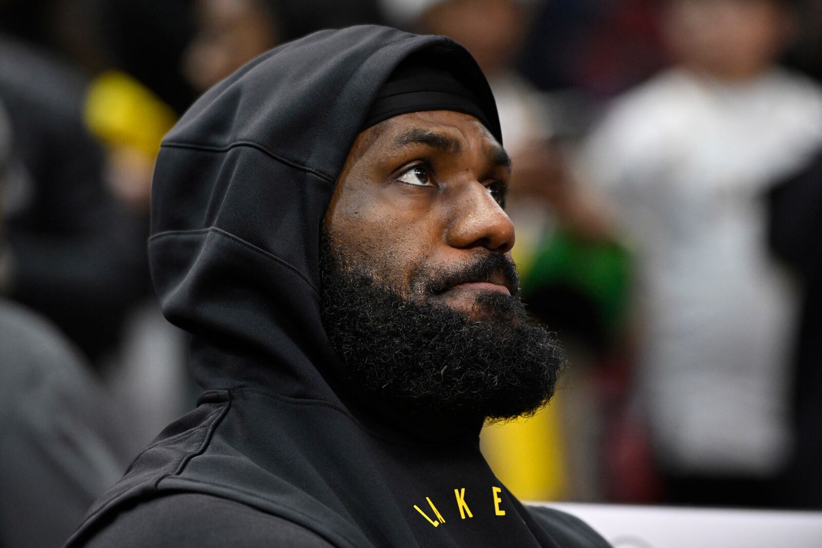 Los Angeles Lakers' LeBron James looks on from the bench before an NBA basketball game against the Chicago Bulls, Thursday, March 27, 2025, in Chicago. (AP Photo/Paul Beaty)