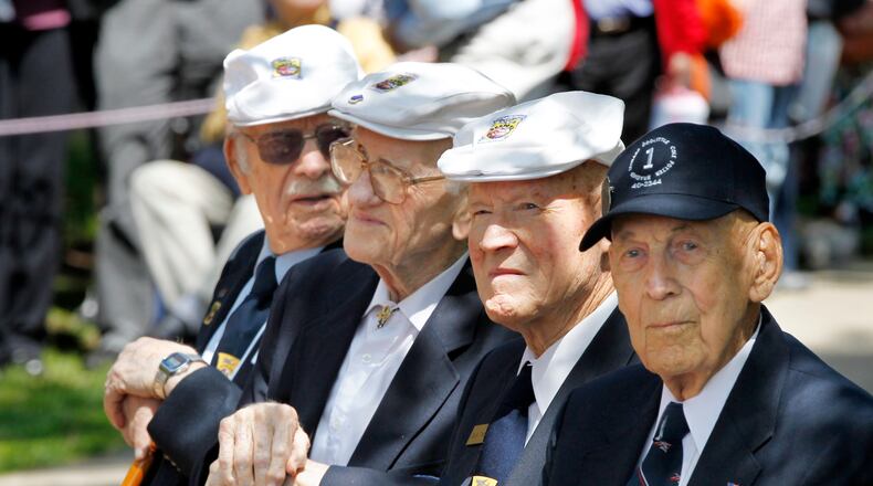The 70th anniversary of the Doolittle Riad was commemorated at the National Museum of the United States Air Force on Wednesday, April 18, 2012. Four of the five surviving crew members attended the ceremony. From left to righ are: Lt. Col. Edward J. Saylor, 92, Maj. Thomas C. Griffin, 95, Staff Sgt. David J. Thatcher, 90, and Lt. Col. Richard E. Cole, 96. --Staff Photo by Ty Greenlees