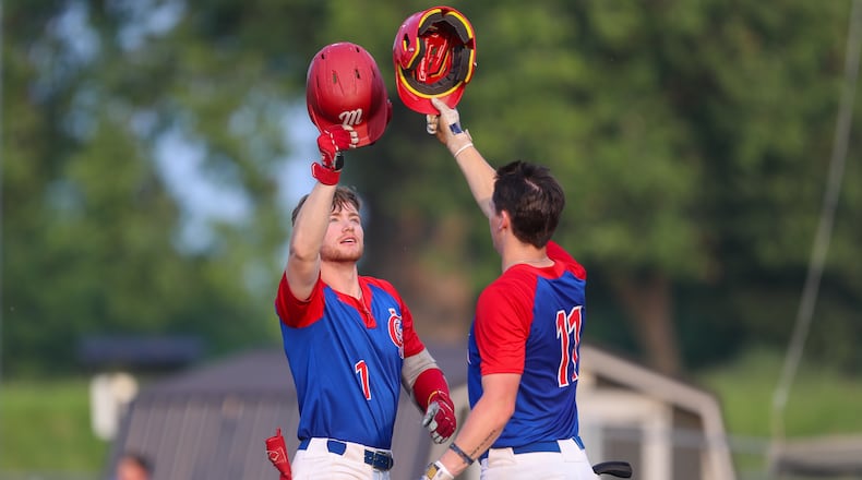 Champion City Kings infielder Blake Buzzeo celebrates with outfielder Tyler Cox after hitting a home run during their game against the Chillicothe Paints on Tuesday, July 25 at Carleton Davidson Stadium in Springfield. CONTRIBUTED PHOTO BY MICHAEL COOPER