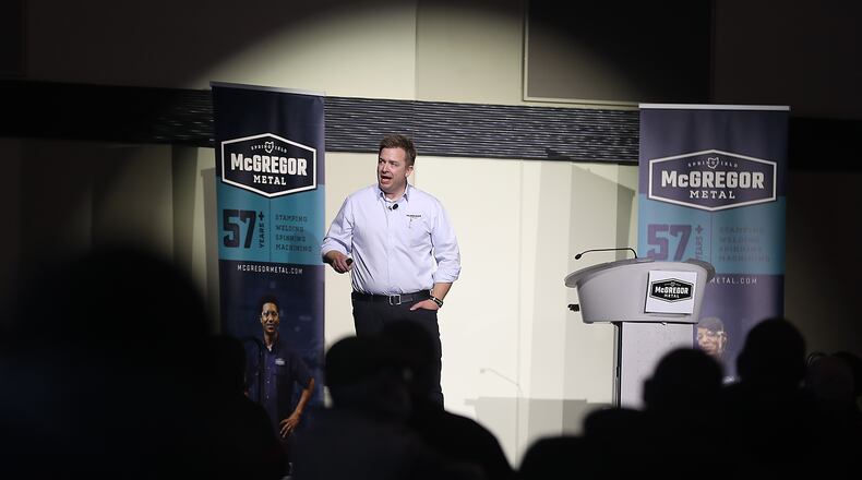 Jamie McGregor, CEO of McGregor Metalworking, was under the spotlight Wednesday morning as he announces the rebranding of all their Clark County companies under one name, McGregor Metal, during a meeting at the Hollenbeck Baley Conference Center. BILL LACKEY/STAFF