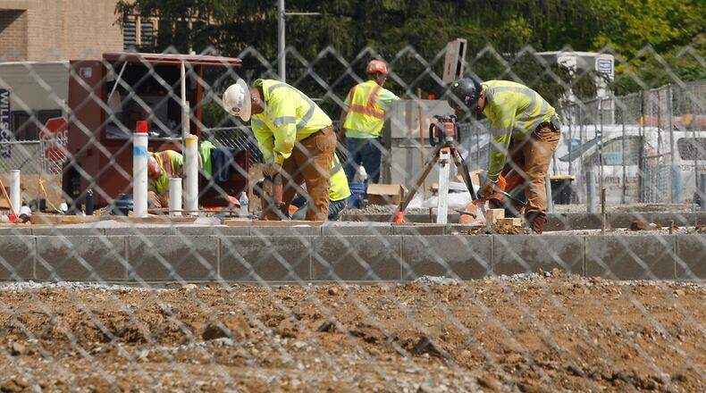 Work continues on the Global Impact STEM Academy's new "Upper Academy" facility on the Clark State Campus Tuesday, April 30, 2024. BILL LACKEY/STAFF