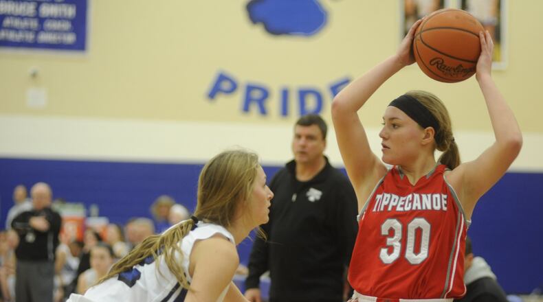 Springboro’s Haylie Crouch (left) defends Allison Mader of Tipp. Springboro defeated visiting Tippecanoe 50-36 in a girls high school basketball game on Sat., Jan. 7, 2017. MARC PENDLETON / STAFF