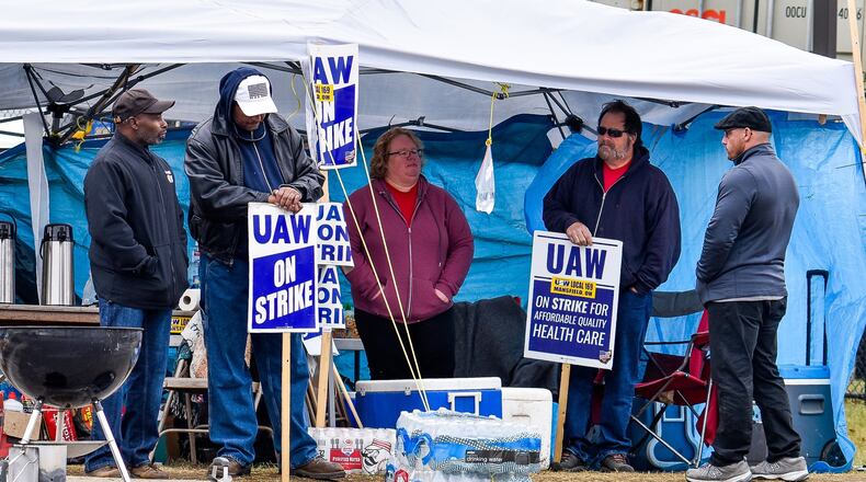 United Auto Workers union members from GM Service Parts Operations plant on Jacquemin Drive in West Chester Township continue to strike Wednesday, Oct. 16. UAW and GM have reaches a tentative agreement that could bring the strike to an end. NICK GRAHAM/STAFF