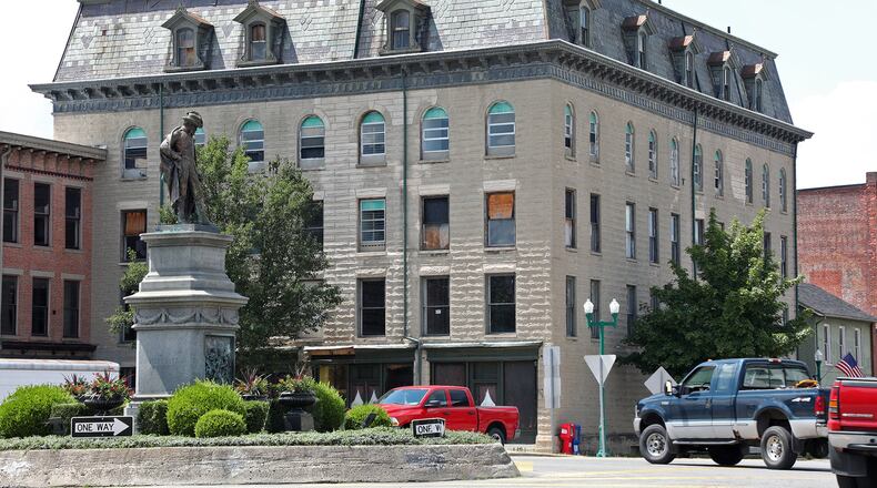 A project to turn the former Douglas Hotel in Urbana into senior living apartments is moving forward. BILL LACKEY/STAFF