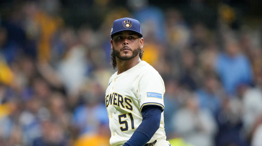 FILE - Milwaukee Brewers pitcher Freddy Peralta walks to the dugout after the top of the fifth inning in Game 2 of baseball's National League Championship Series against the Los Angeles Dodgers, Oct. 14, 2025, in Milwaukee. (AP Photo/Brynn Anderson, File)