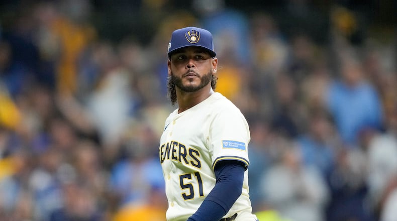 FILE - Milwaukee Brewers pitcher Freddy Peralta walks to the dugout after the top of the fifth inning in Game 2 of baseball's National League Championship Series against the Los Angeles Dodgers, Oct. 14, 2025, in Milwaukee. (AP Photo/Brynn Anderson, File)