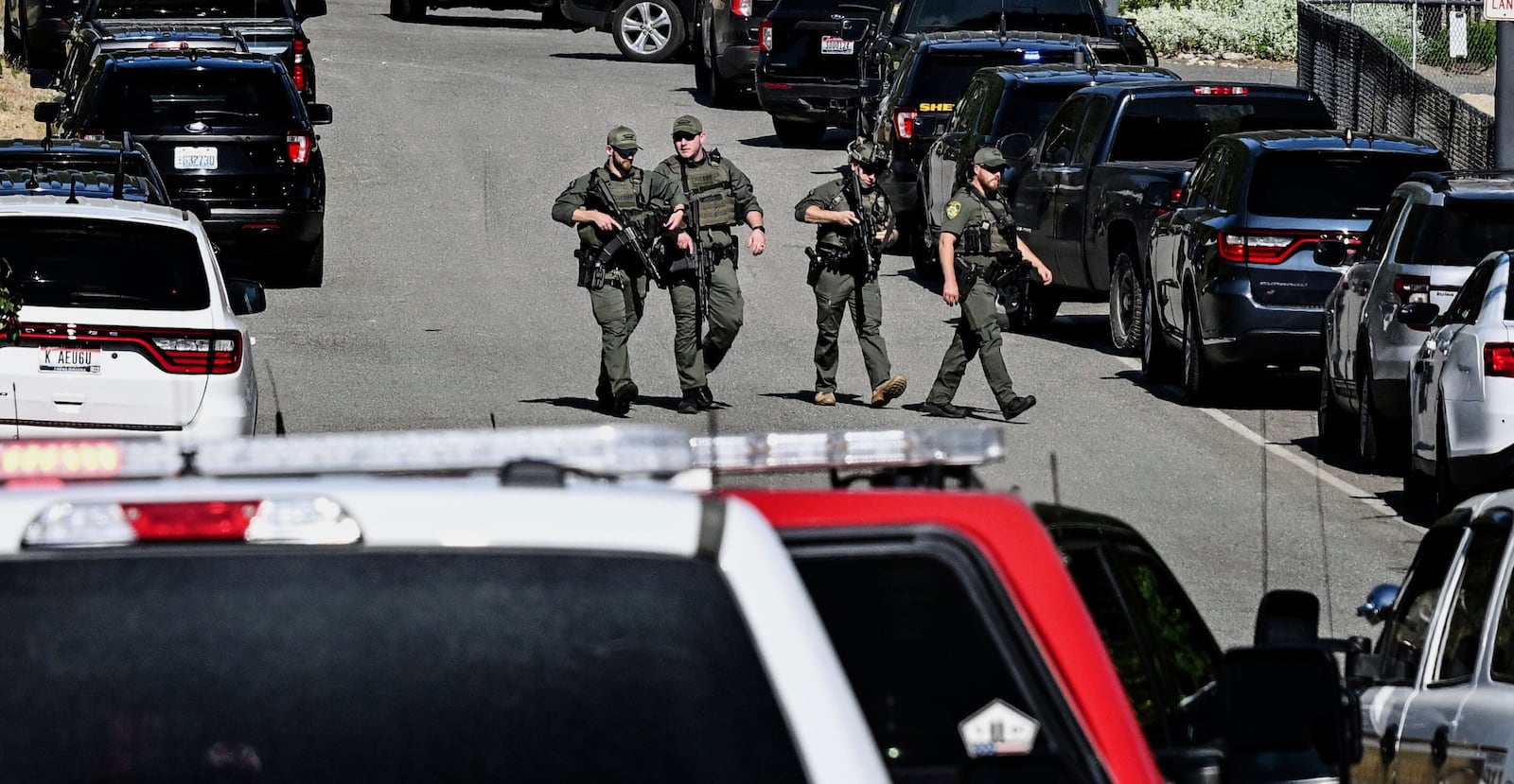 Police and fire crews respond to a shooting and fire on Canfield Mountain in Coeur d'Alene, Idaho, Sunday, June 29, 2025. (Kathy Plonka/The Spokesman-Review via AP)