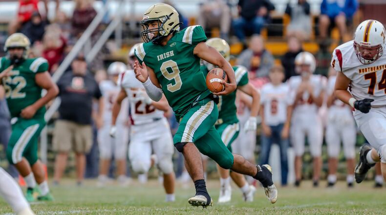 Catholic Central High School junior Brayden Strother returns an interception during their game against Northeastern on Friday night at Hallinean Field in Springfield. Strother scored on the play. Michael Cooper/CONTRIBUTED
