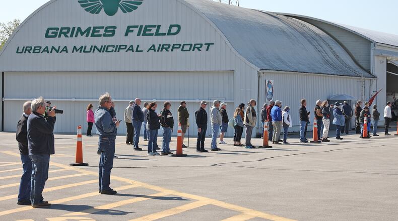 A crowd gathers at Grimes Field in Urbana in April. BILL LACKEY/STAFF