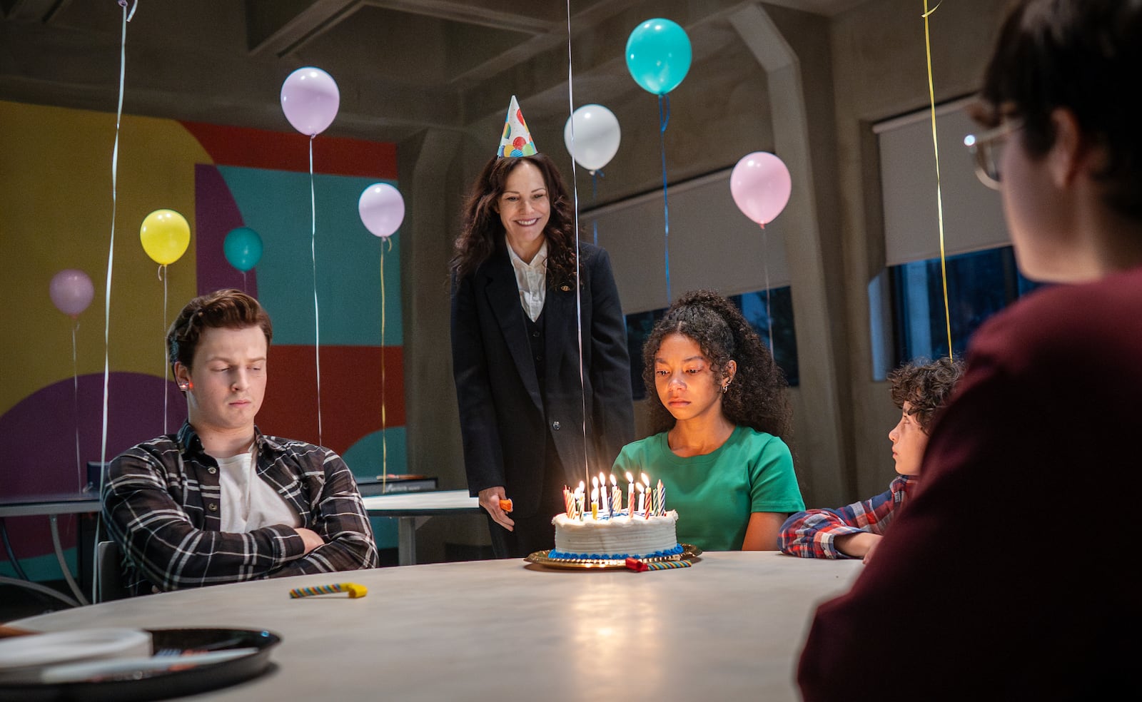 This image released by MGM+ shows Fionn Laird, from left, Mary-Louise Parker, Simone Miller, Viggo Hanvelt and Arlen So in a scene from "The Institute." (Chris Reardon/MGM+ via AP)
