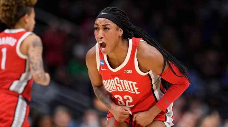 Ohio State forward Cotie McMahon (32) celebrates after scoring a basket as her team takes the lead over UConn in the second quarter of a Sweet 16 college basketball game of the NCAA Tournament in Seattle, Saturday, March 25, 2023. (AP Photo/Caean Couto)