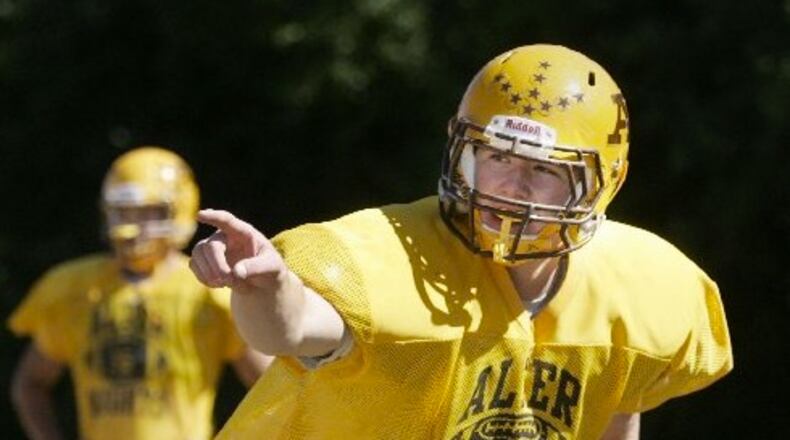 Joe Thuney calles out a signal as he practices with the offensive line during an Alter High School football scrimage in 2010. Ron Alvey/Staff