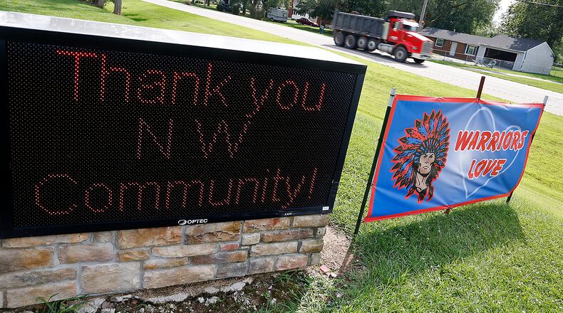 Signs in front of the Lawrenceville Church of God along Troy Road Thursday, August 24, 2024. BILL LACKEY/STAFF