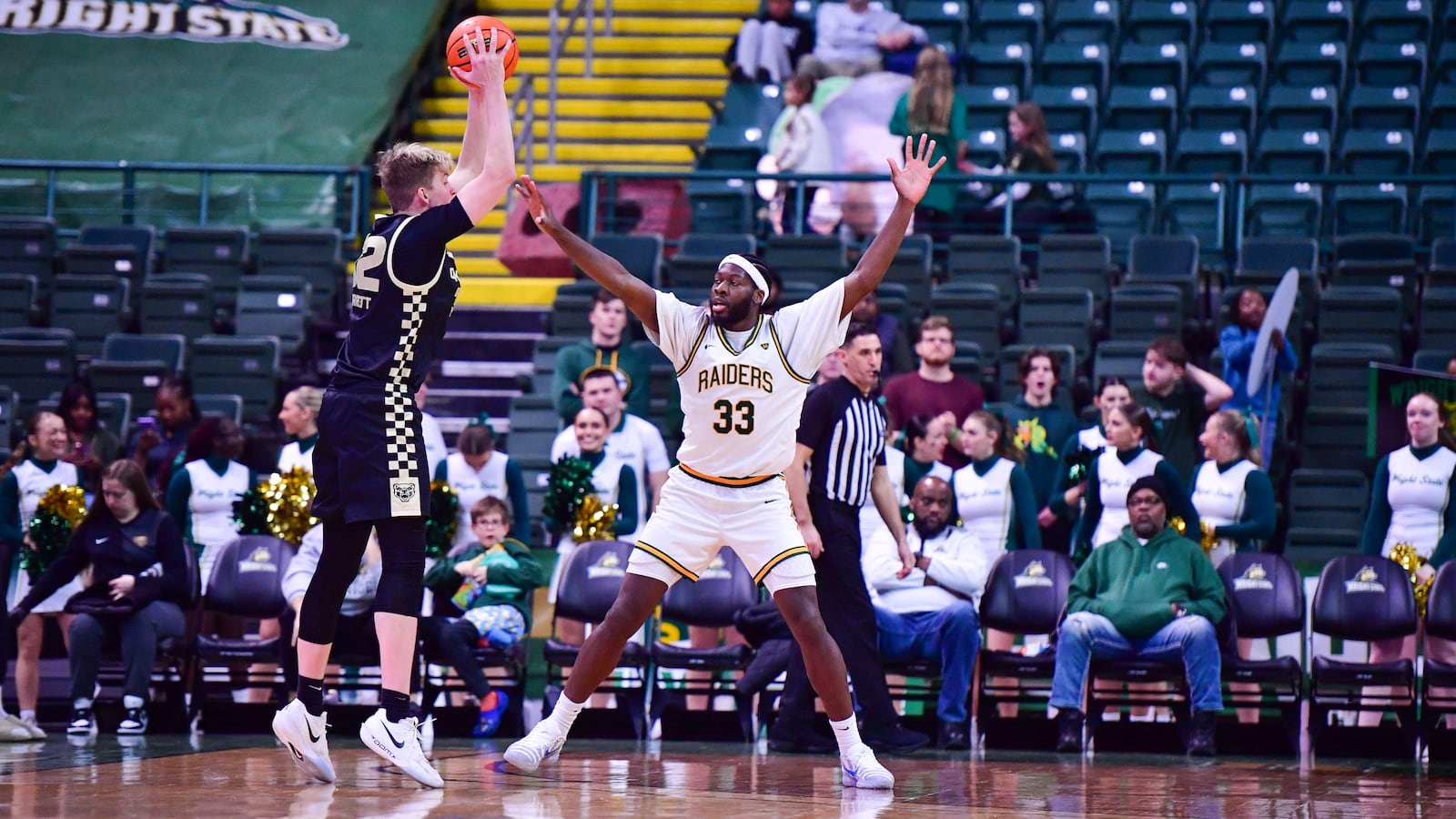 Wright State University's Michael Imariagbe guards Oakland's Isaac Garrett during their game on Monday, Dec. 29 at Wright State's Nutter Center. JOSEPH R. CRAVEN / CONTRIBUTED PHOTO