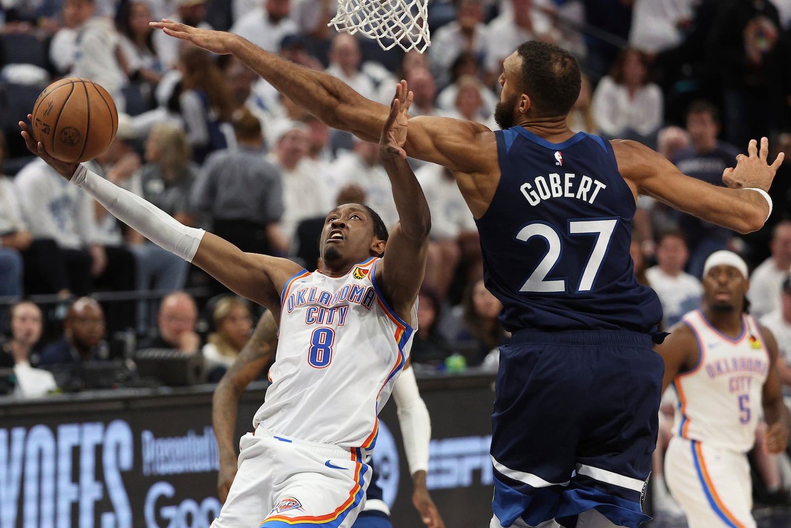 Oklahoma City Thunder forward Jalen Williams (8) shoots against Minnesota Timberwolves center Rudy Gobert (27) during the second half of Game 4 of the Western Conference finals of the NBA basketball playoffs Monday, May 26, 2025, in Minneapolis. (AP Photo/Matt Krohn)