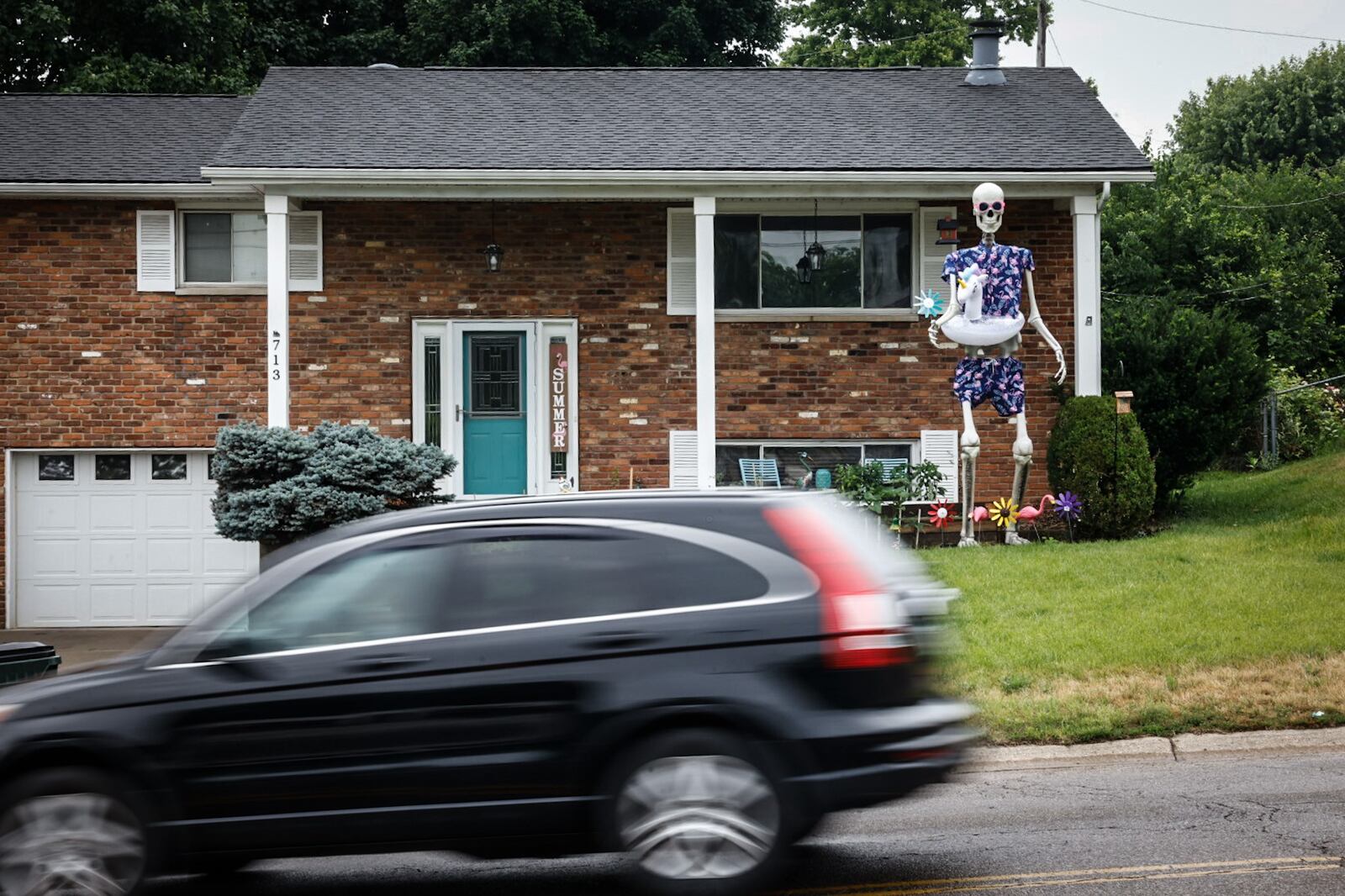 Cyndi White and Jason Thurman are owners of Frank the skeleton on North Heincke Road in Miamisburg. Frank is a Halloween decoration but the couple dress him up for all the holidays and leave him in the yard. JIM NOELKER/STAFF